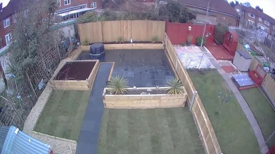 Aerial view of raised sleeper beds, slate paving and new turf